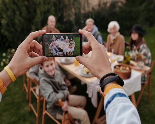 A family sitting together having a meal without any digital screens